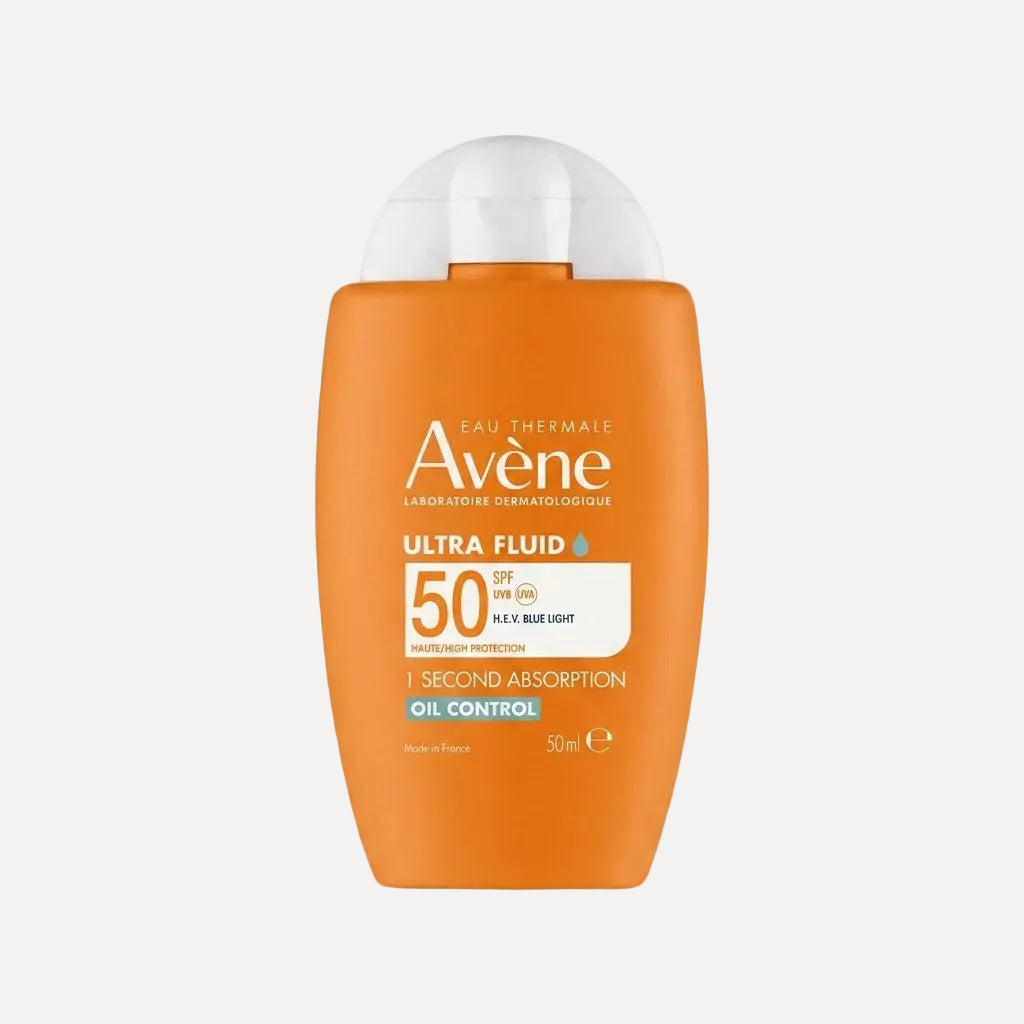 Orange bottle of Avene Ultra Fluid sunscreen with SPF 50 on a white background